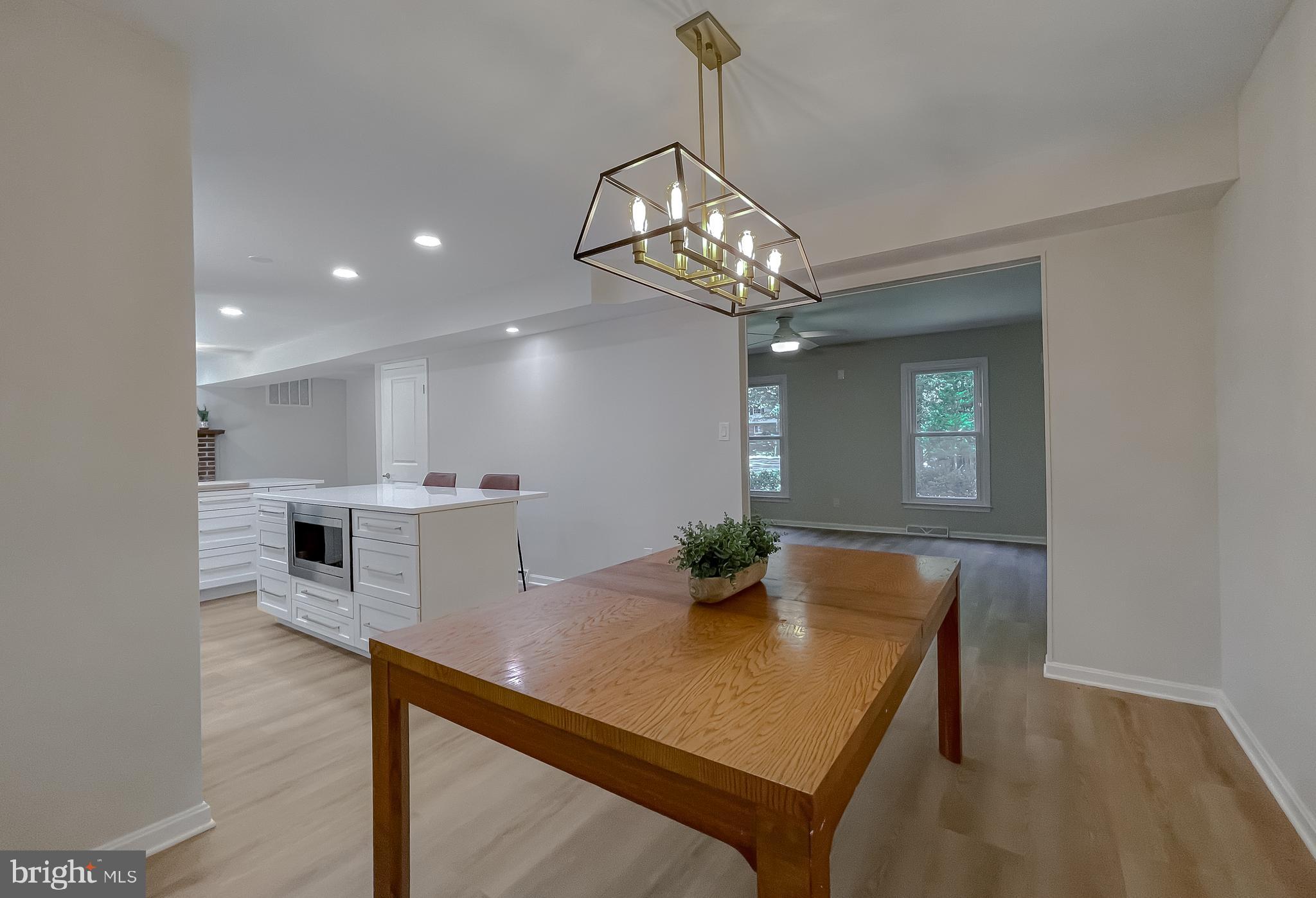 22373 Enoch Road Leonardtown, MD 20650 - Photo 11 of 74 a view of a dining room with furniture and wooden floor