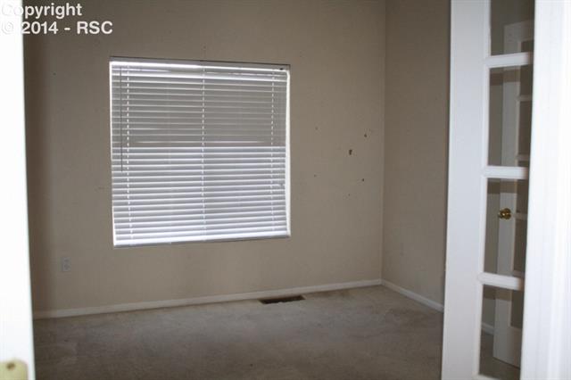 7714 Old Spec Road Peyton, CO 80831 - Photo 4 of 15 Office/Bedroom with Walk-In Closet & French Doors off Great Room