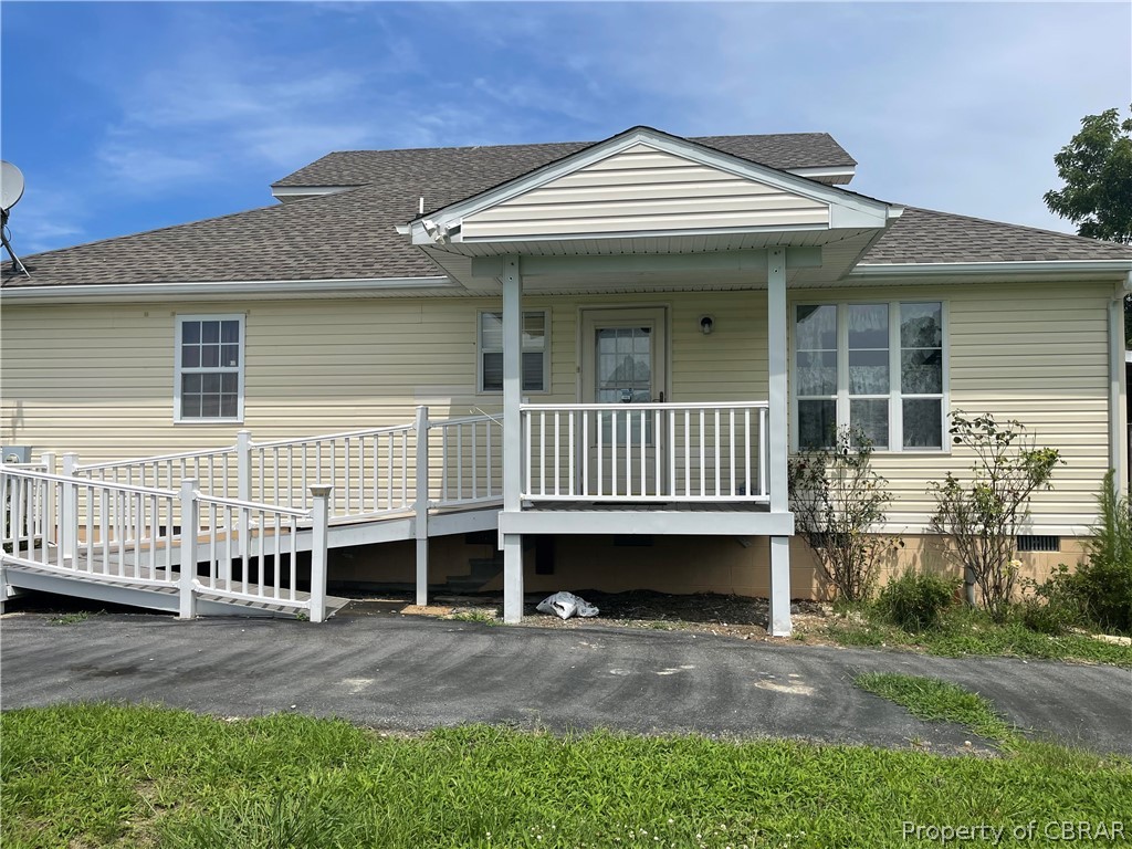 151 Thomas Landing Road Lancaster, VA 22503 - Photo 14 of 39 a front view of a house with a porch