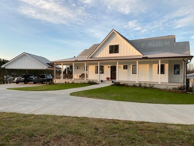 2136 Double Springs Church Road Monroe, GA 30656 - Photo 1 of 1 a front view of a house with a yard and garage