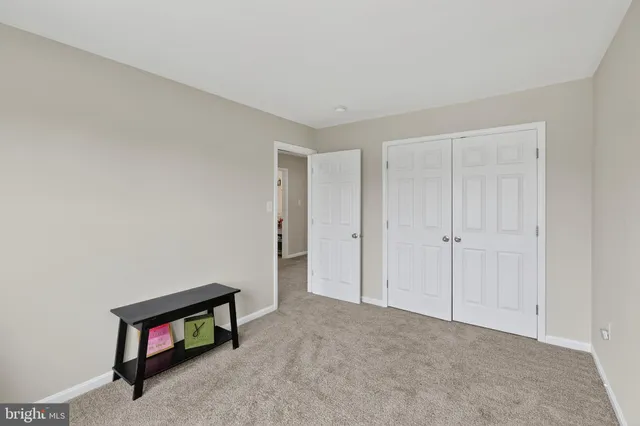 a room with a bed and a window