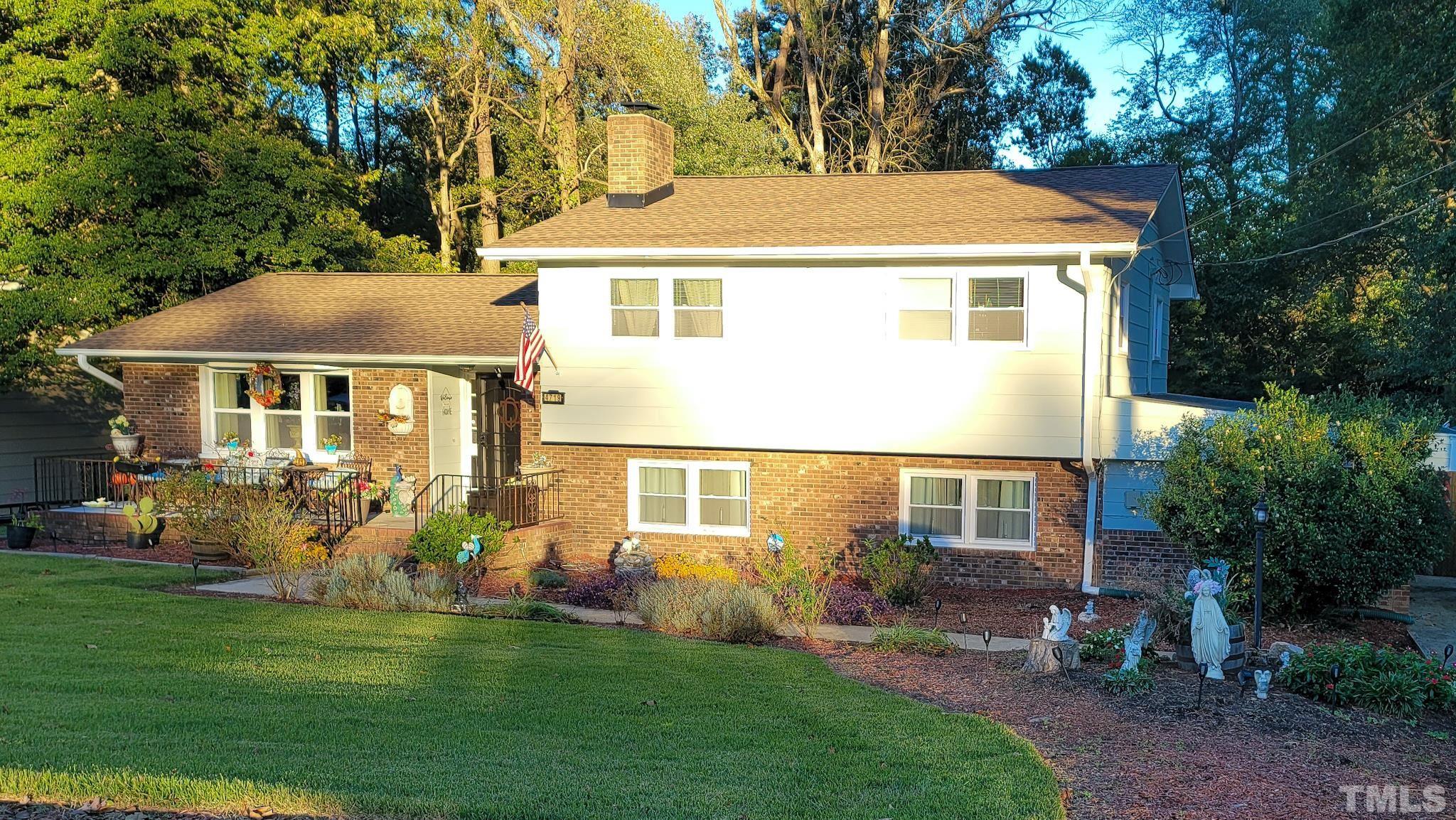 4719 Forestdale Road Raleigh, NC 27603 - Photo 1 of 28 a front view of a house with garden