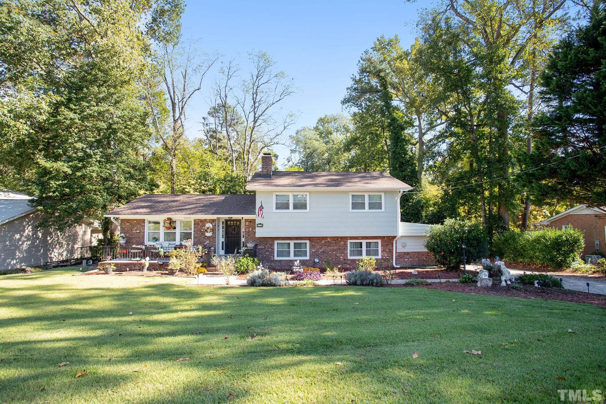 4719 Forestdale Road Raleigh, NC 27603 - Photo 2 of 28 a view of a house with a big yard patio and a patio