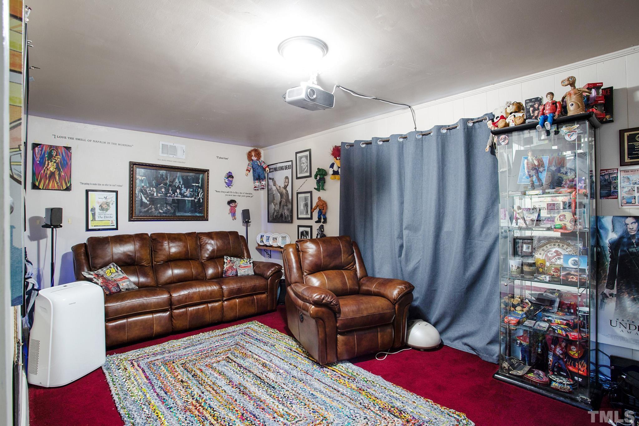 4719 Forestdale Road Raleigh, NC 27603 - Photo 20 of 28 a living room with furniture and a rug