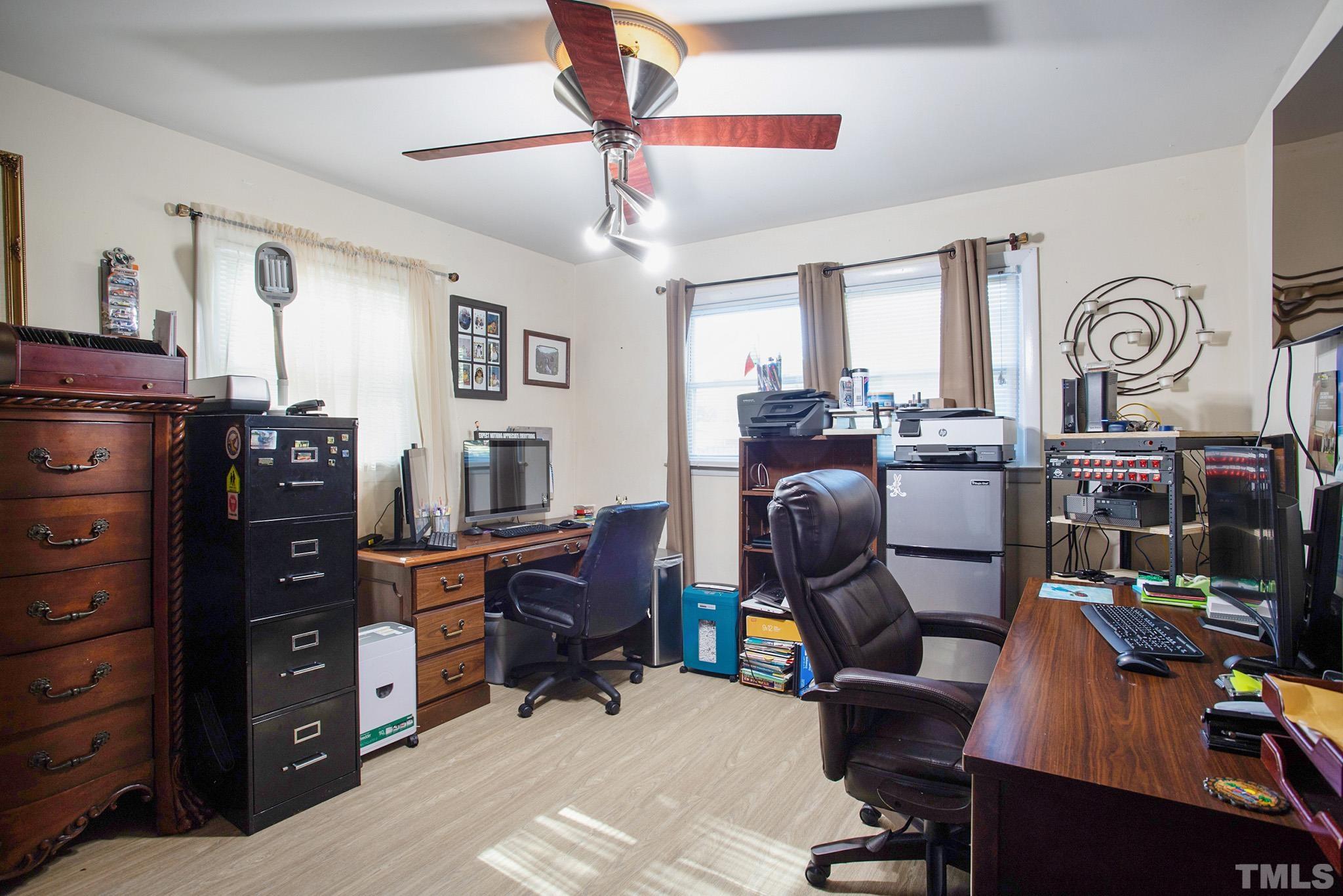 4719 Forestdale Road Raleigh, NC 27603 - Photo 26 of 28 a view of a workspace with furniture and a window