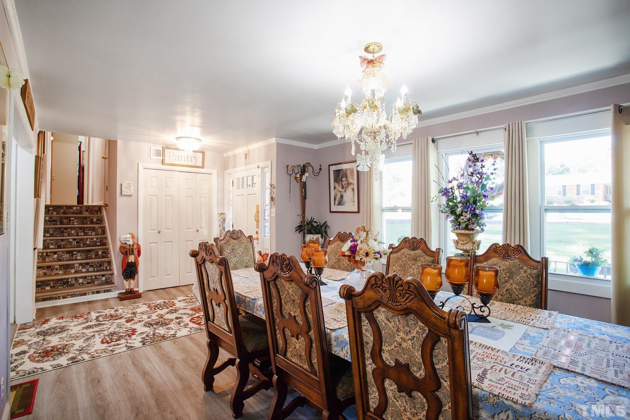4719 Forestdale Road Raleigh, NC 27603 - Photo 8 of 28 a view of a dining room with furniture window and outside view