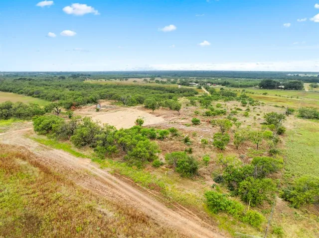 a view of an ocean and a yard