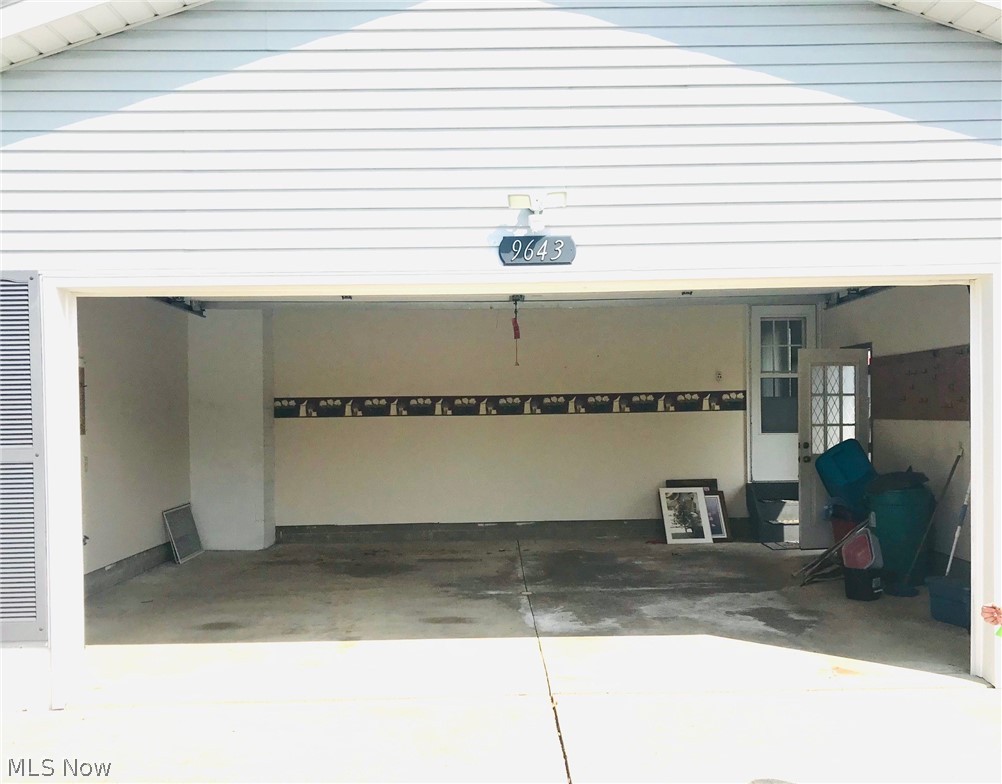9643 Tallmadge Road Diamond, OH 44412 - Photo 31 of 35 Large attached garage parks two cars nicely with room to spare and enough to walk around the cars!