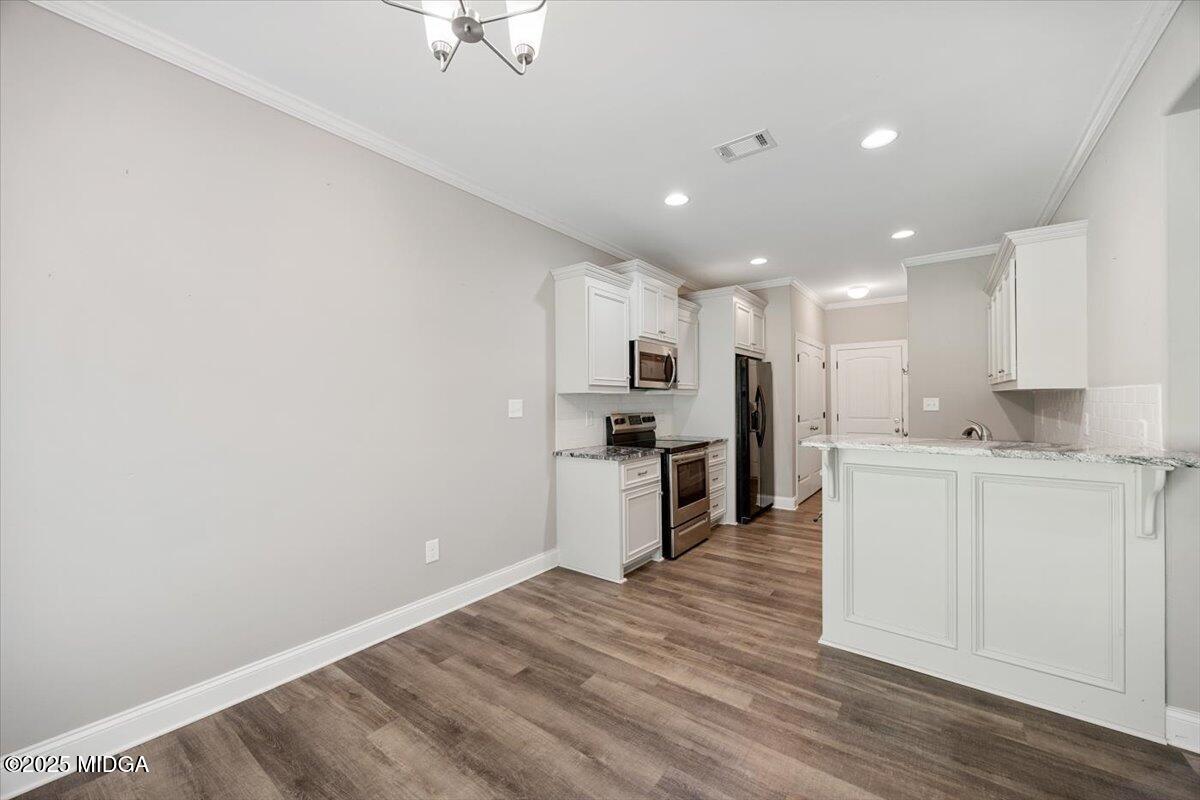14 Carters Way Forsyth, GA 31029 - Photo 8 of 23 a view of kitchen with wooden floor