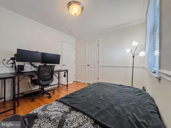 a bedroom with a bed and chair