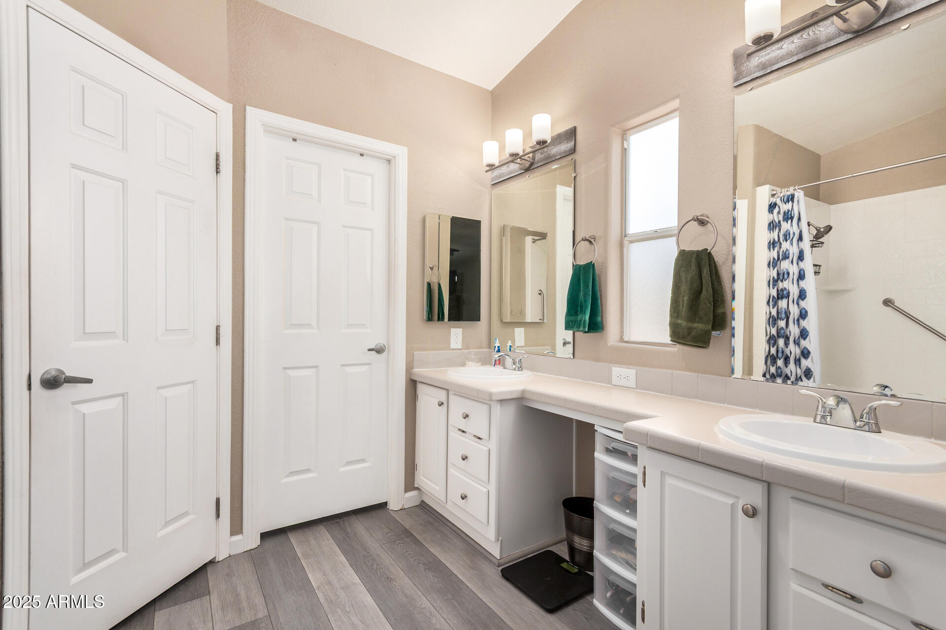 3301 South Goldfield Road, Unit 1002 Apache Junction, AZ 85119 - Photo 14 of 25 a bathroom with a double vanity sink mirror and