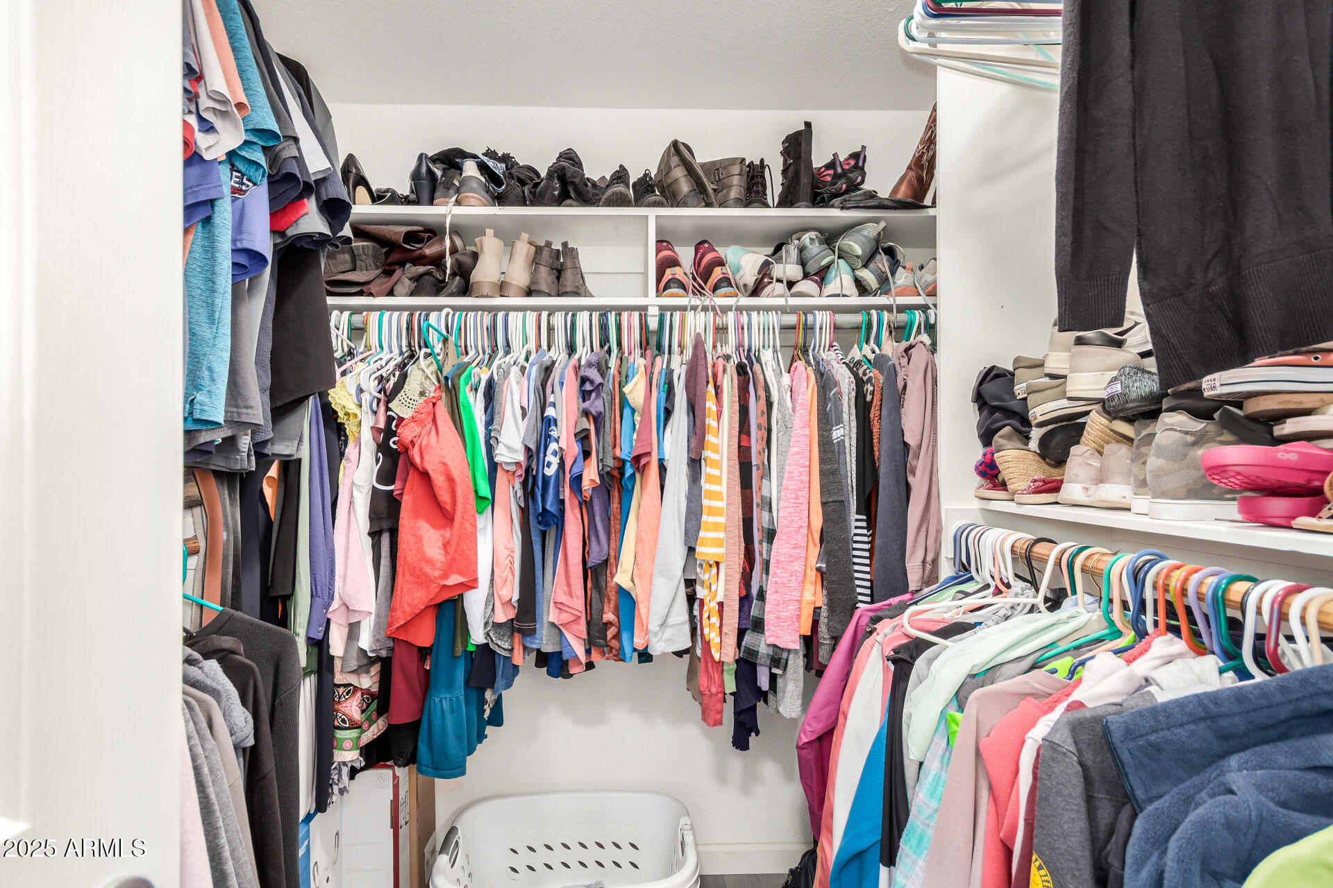 3301 South Goldfield Road, Unit 1002 Apache Junction, AZ 85119 - Photo 16 of 25 a view of walk in closet with clothes and shoes