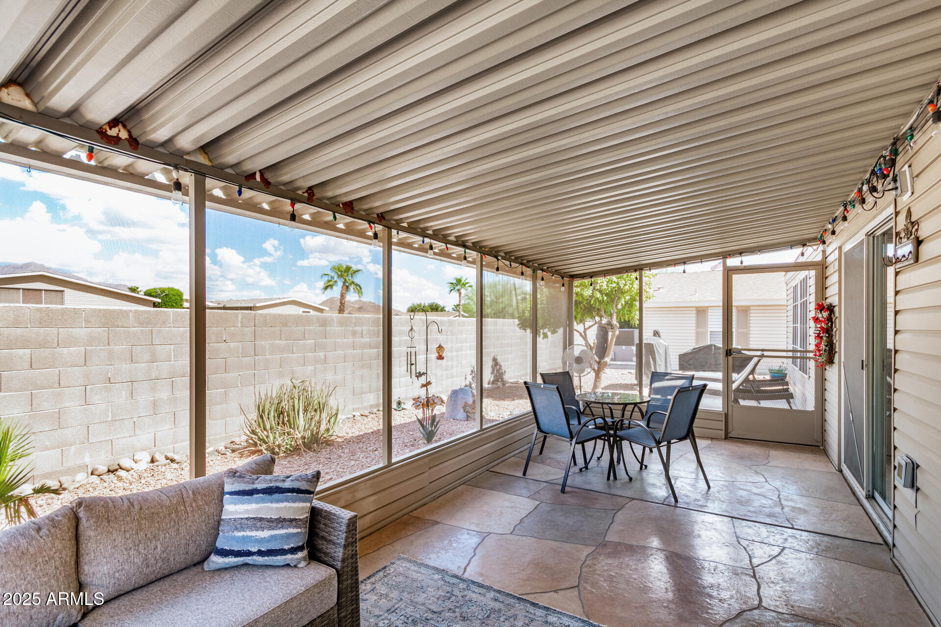 3301 South Goldfield Road, Unit 1002 Apache Junction, AZ 85119 - Photo 23 of 25 a living room with furniture and a large window
