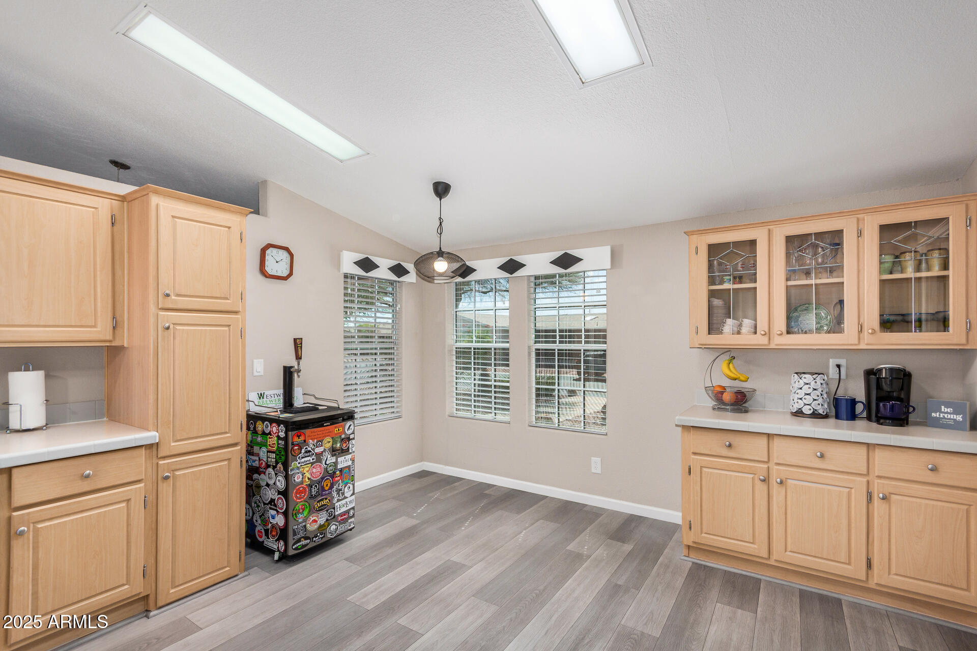 3301 South Goldfield Road, Unit 1002 Apache Junction, AZ 85119 - Photo 8 of 25 a very nice looking room with wooden floor and white walls