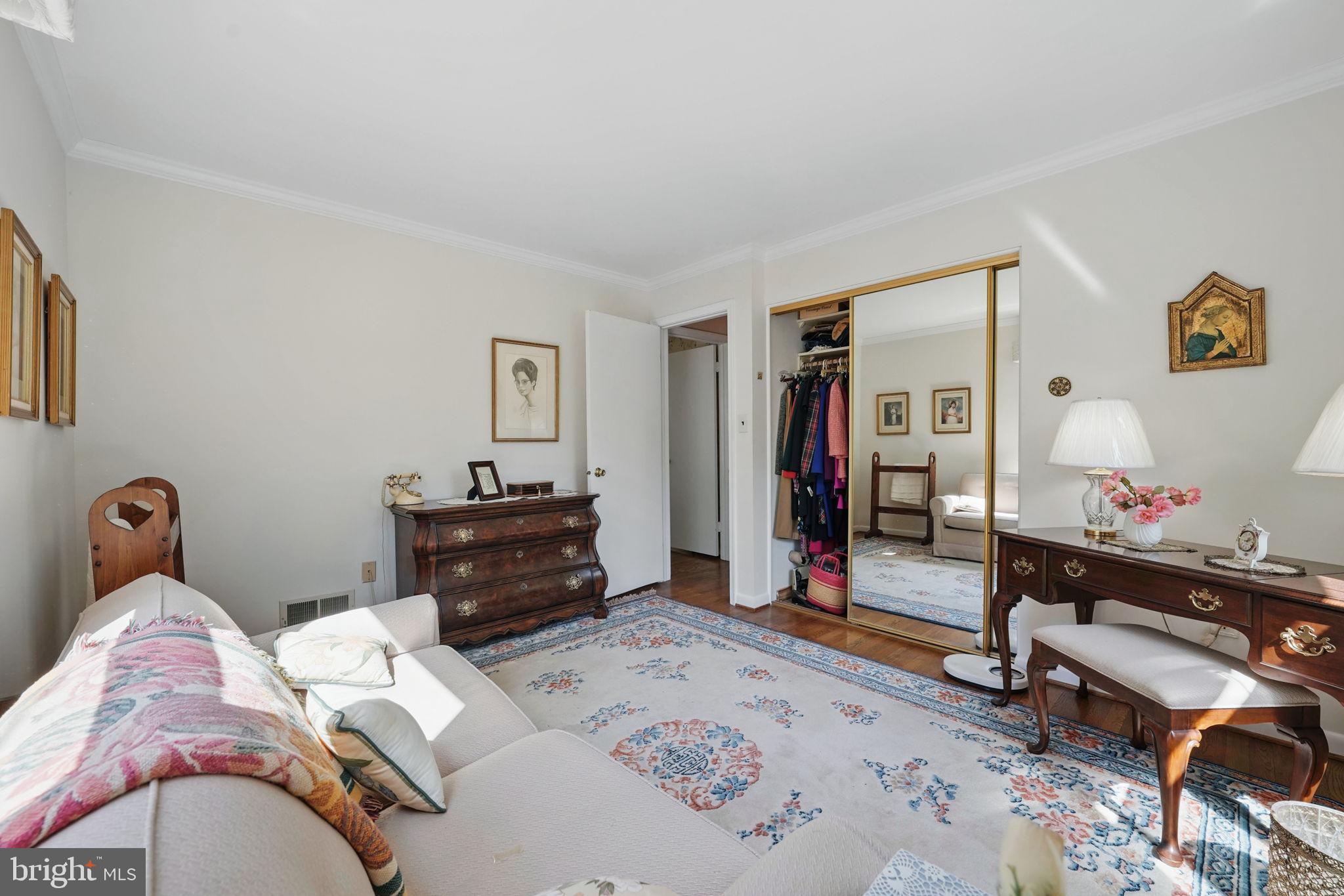 4602 Old Mill Road Alexandria, VA 22309 - Photo 21 of 46 a bedroom with a bed and wooden floor