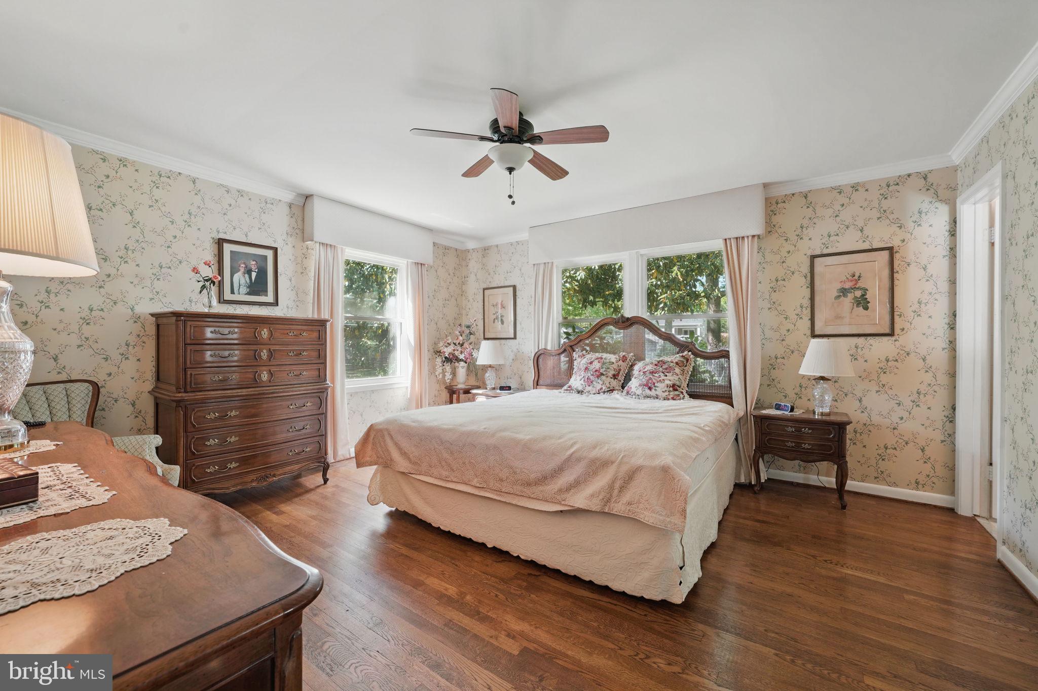 4602 Old Mill Road Alexandria, VA 22309 - Photo 22 of 46 a bedroom with a bed and wooden floor