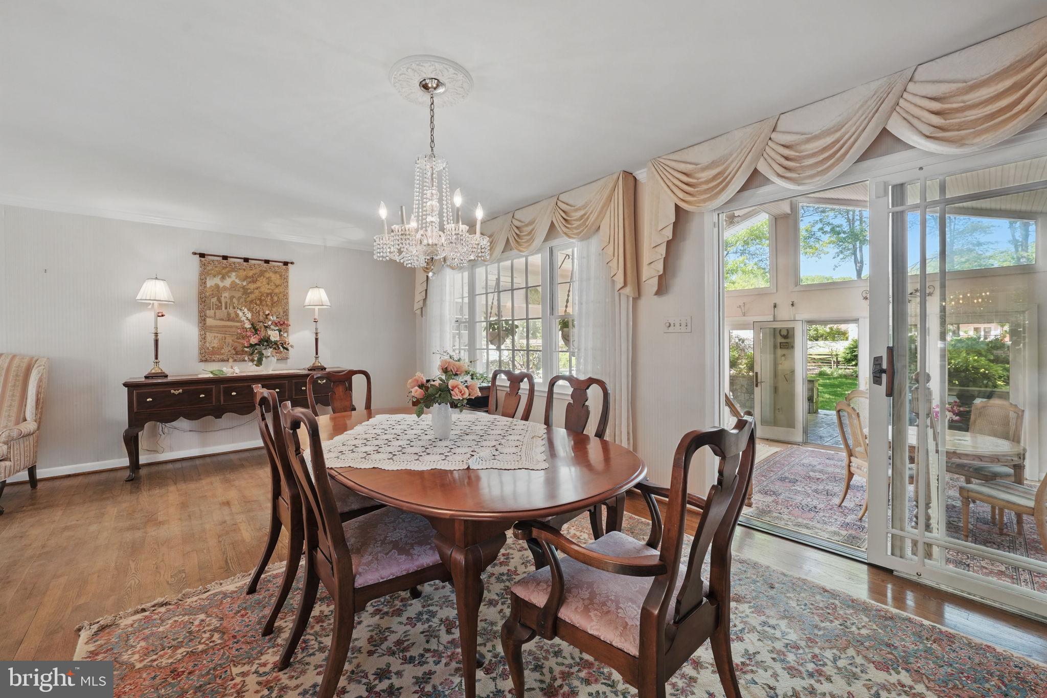 4602 Old Mill Road Alexandria, VA 22309 - Photo 35 of 46 a view of a dining room with furniture window and wooden floor