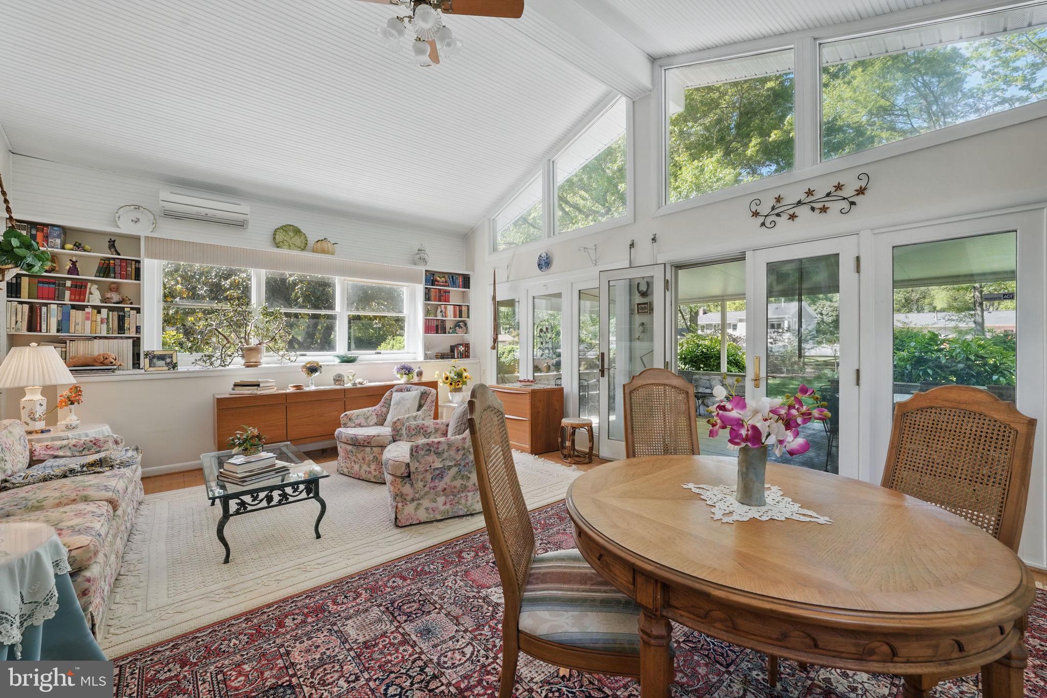 4602 Old Mill Road Alexandria, VA 22309 - Photo 4 of 46 a dining room with furniture a rug and a large window