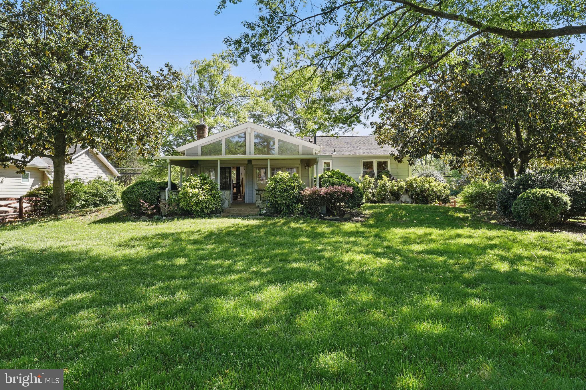 4602 Old Mill Road Alexandria, VA 22309 - Photo 41 of 46 a front view of a house with garden