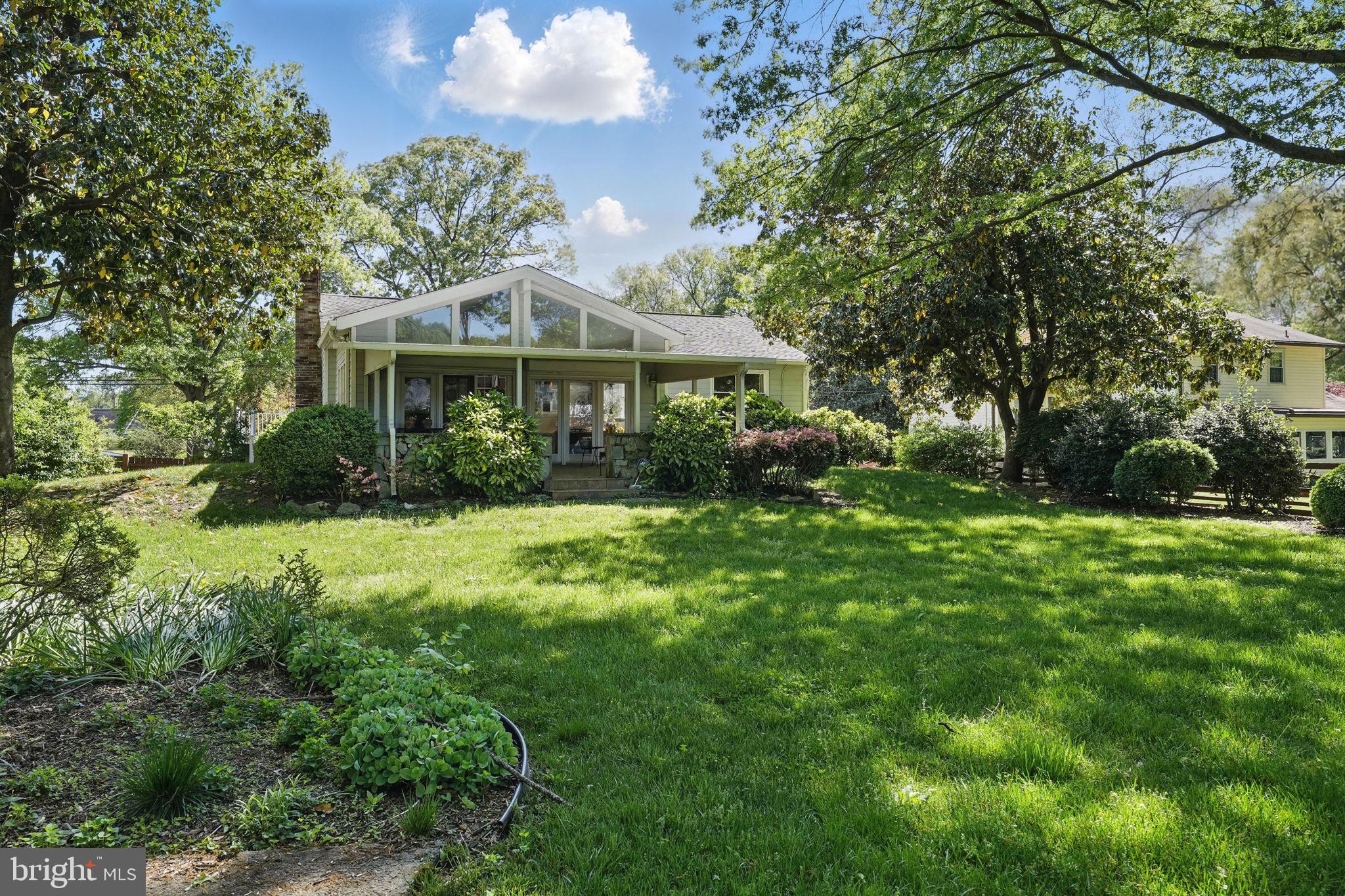 4602 Old Mill Road Alexandria, VA 22309 - Photo 42 of 46 a front view of a house with a yard