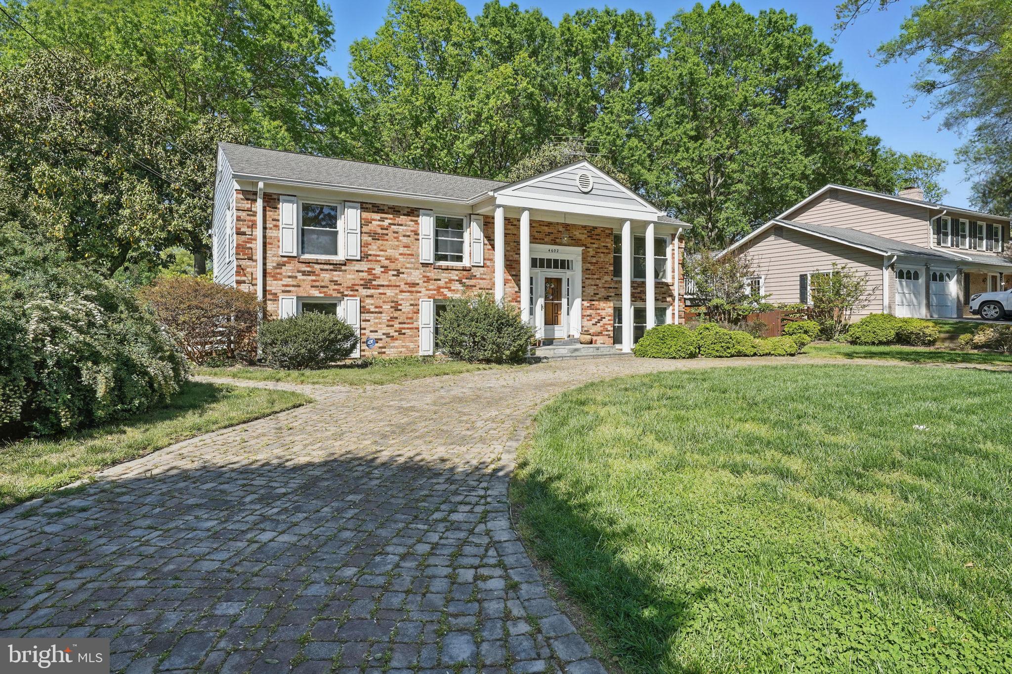 4602 Old Mill Road Alexandria, VA 22309 - Photo 6 of 46 a front view of a house with a yard