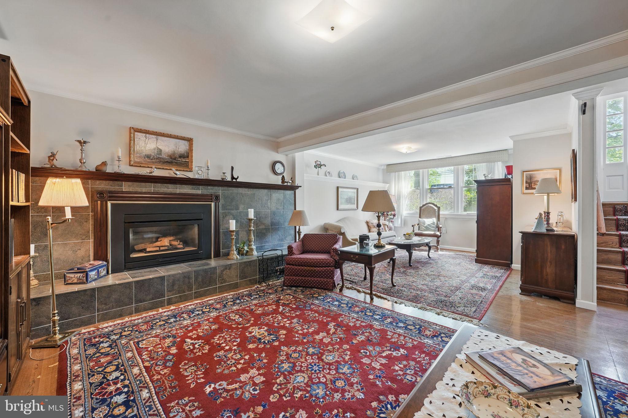 4602 Old Mill Road Alexandria, VA 22309 - Photo 8 of 46 a living room with furniture a rug and a fireplace