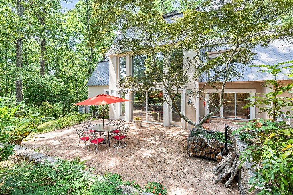 8569 Jefferson Road Commerce, GA 30529 - Photo 15 of 82 an outdoor space with patio and white umbrellas