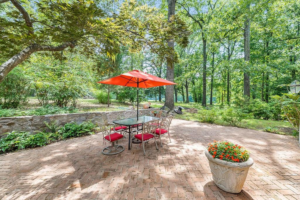 8569 Jefferson Road Commerce, GA 30529 - Photo 17 of 82 a view of a backyard with a patio and garden
