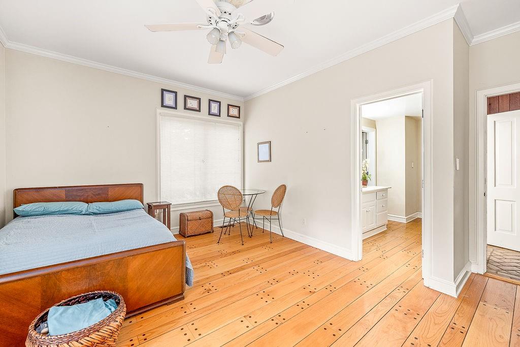 8569 Jefferson Road Commerce, GA 30529 - Photo 31 of 82 a bedroom with a bed and a chandelier