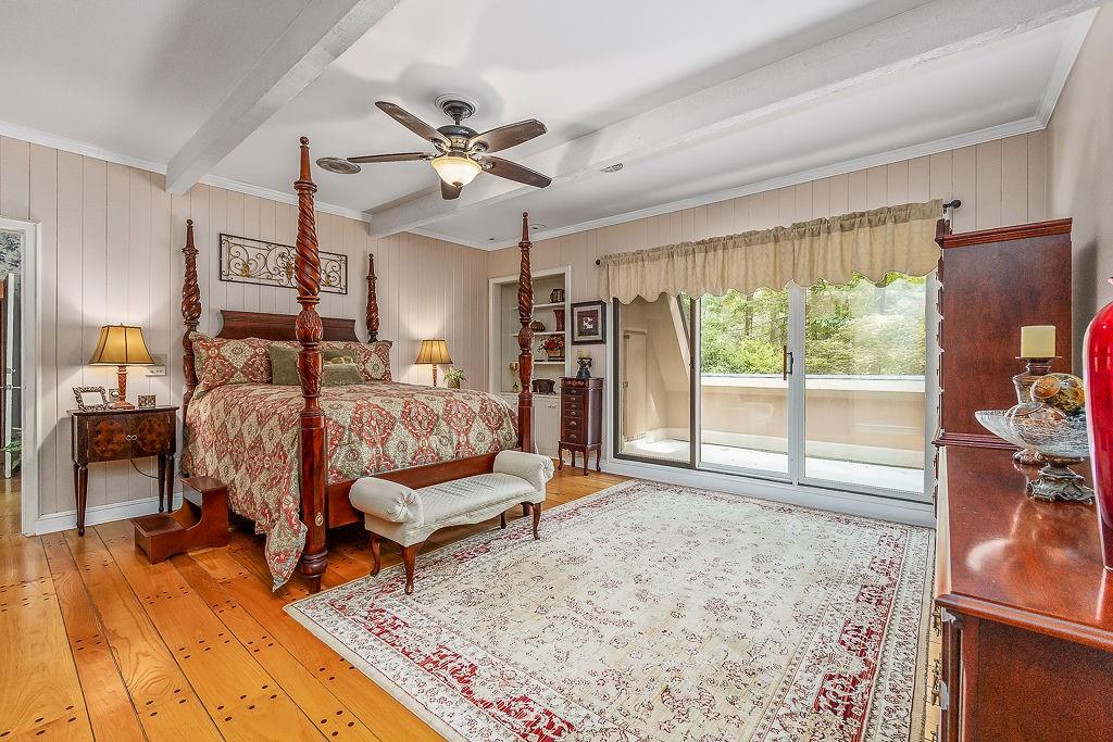8569 Jefferson Road Commerce, GA 30529 - Photo 35 of 82 a bedroom with furniture and wooden floor