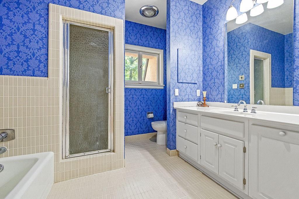 8569 Jefferson Road Commerce, GA 30529 - Photo 38 of 82 a bathroom with a double vanity sink a toilet and shower