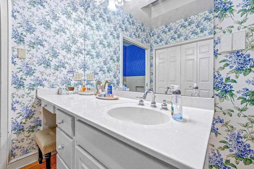 8569 Jefferson Road Commerce, GA 30529 - Photo 39 of 82 a bathroom with a sink and a mirror