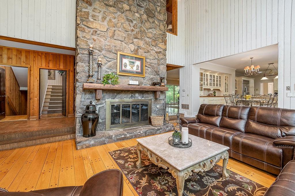 8569 Jefferson Road Commerce, GA 30529 - Photo 10 of 82 a living room with fireplace furniture and a fireplace