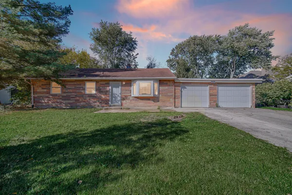 front view of a house with a yard