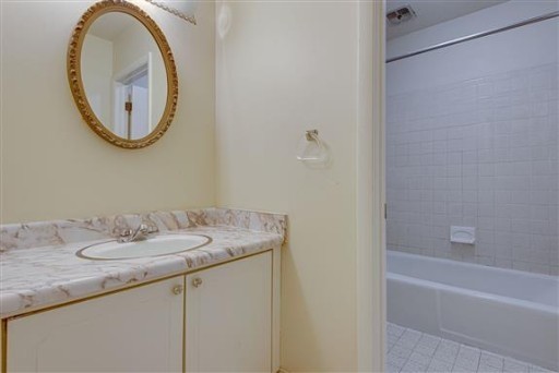 1900 Richard Jones Road, Unit V2 Nashville, TN 37215 - Photo 14 of 23 a bathroom with a granite countertop sink and a mirror
