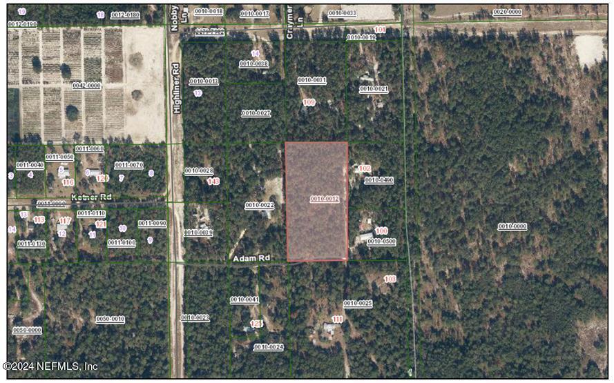 112 Adam Road Welaka, FL 32112 - Photo 1 of 2 an aerial view of a residential apartment building with a yard