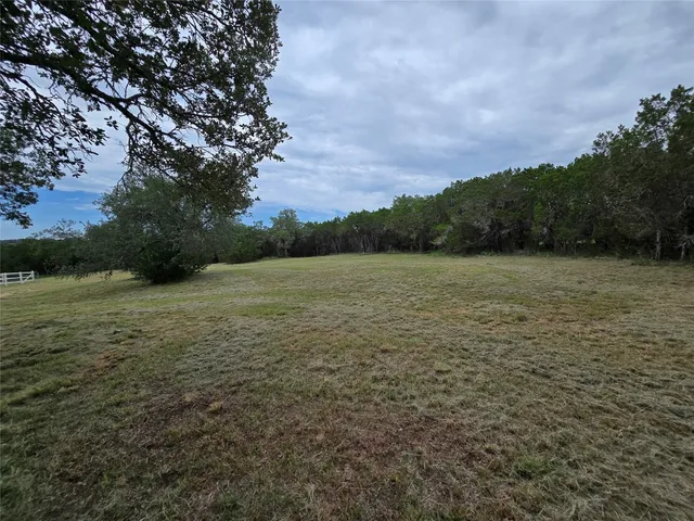 a view of a lake with a big yard