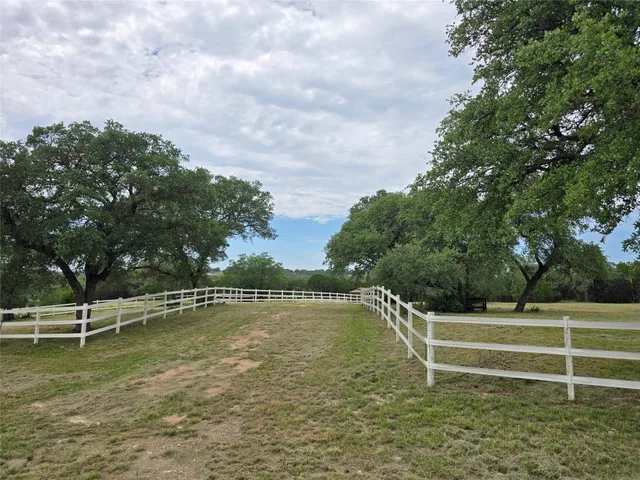 a view of a swimming pool with a bench in the background