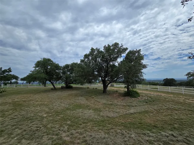 a view of a golf course with a trees