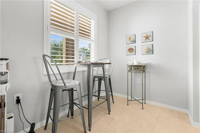 a kitchen with refrigerator and cabinets