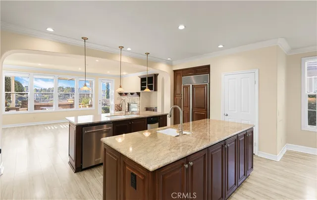 a kitchen with counter top space cabinets and wooden floor