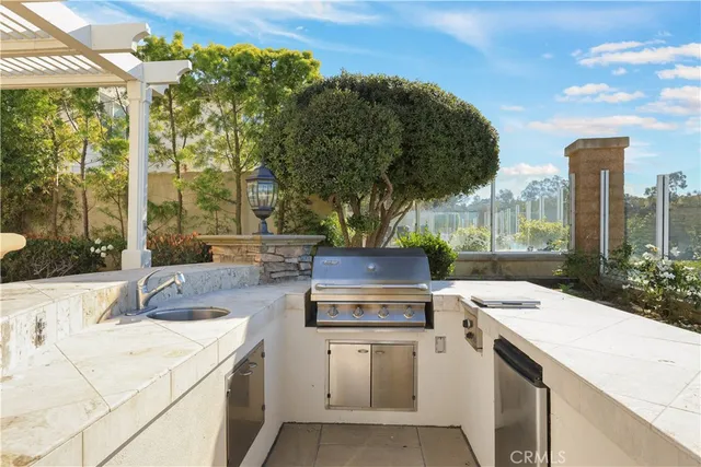 a view of a patio with swimming pool and table and chairs