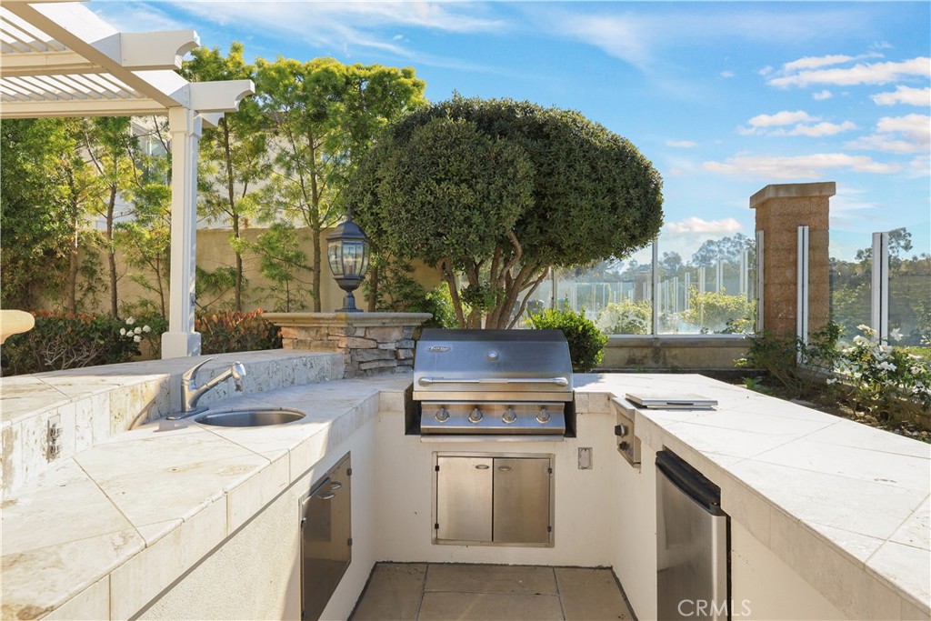 18 Vernon Newport Coast, CA 92657 - Photo 45 of 52 a view of a kitchen with a stove and a microwave oven