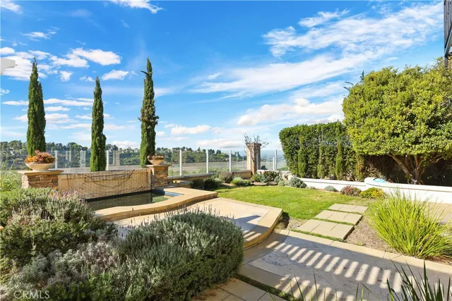 a view of a lake with houses in the back