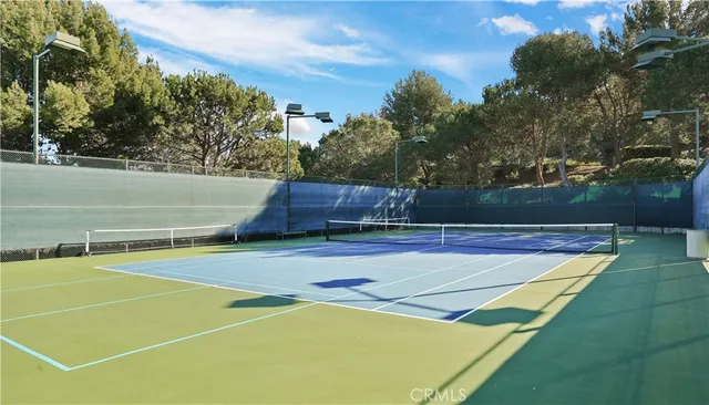 a view of a playground with basketball court