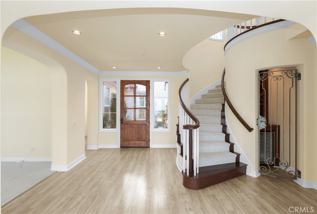 18 Vernon Newport Coast, CA 92657 - Photo 5 of 52 a view of entryway with wooden floor and stairs