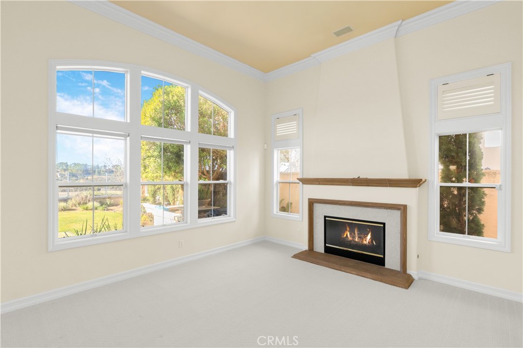 18 Vernon Newport Coast, CA 92657 - Photo 9 of 52 a view of an empty room with a window and fireplace