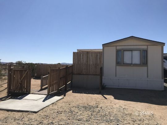 4233 West Ward Avenue Ridgecrest, CA 93555 - Photo 2 of 19 a backyard of a house