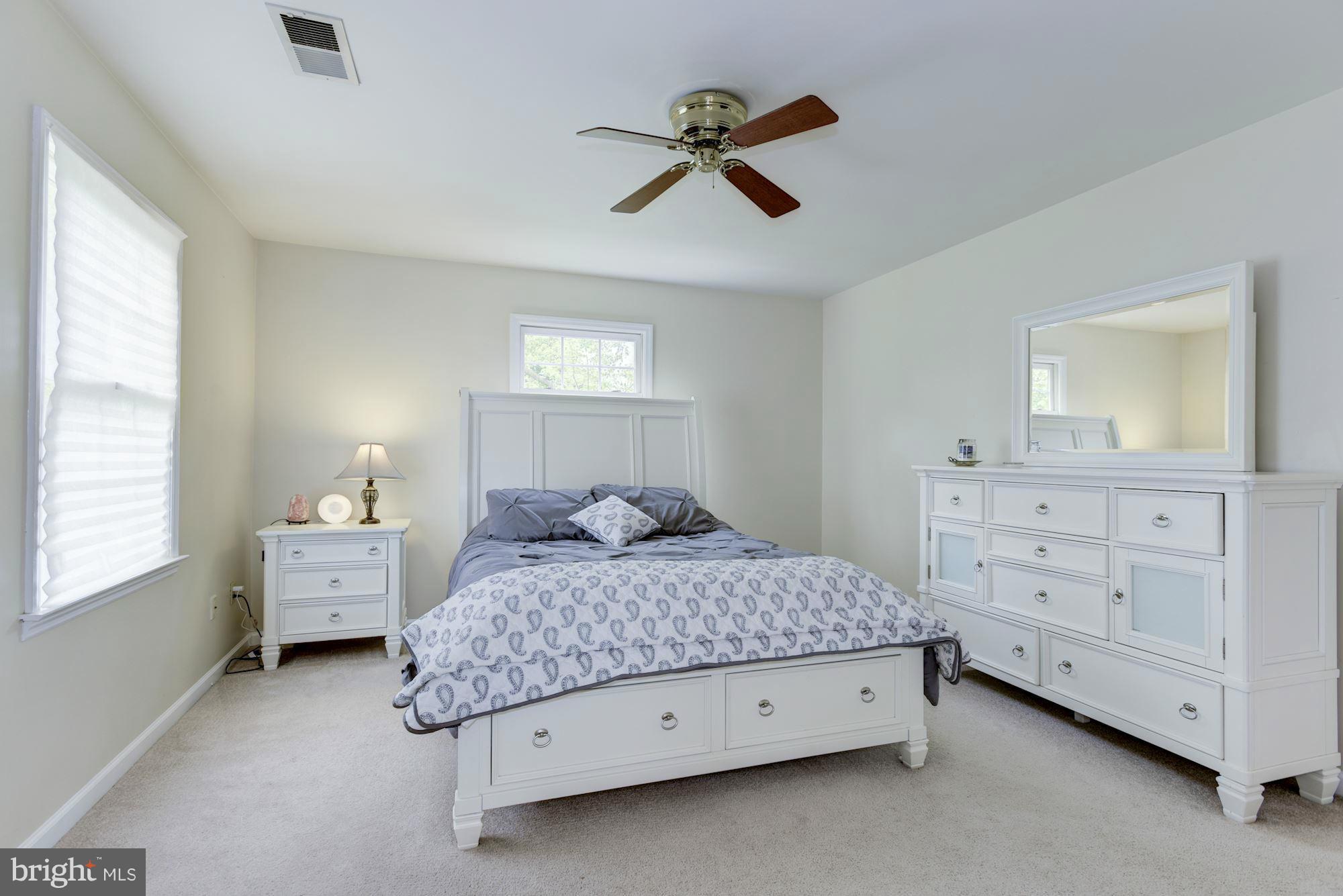 17 New Cut Road Round Hill, VA 20141 - Photo 14 of 29 a bedroom with a bed and a dresser