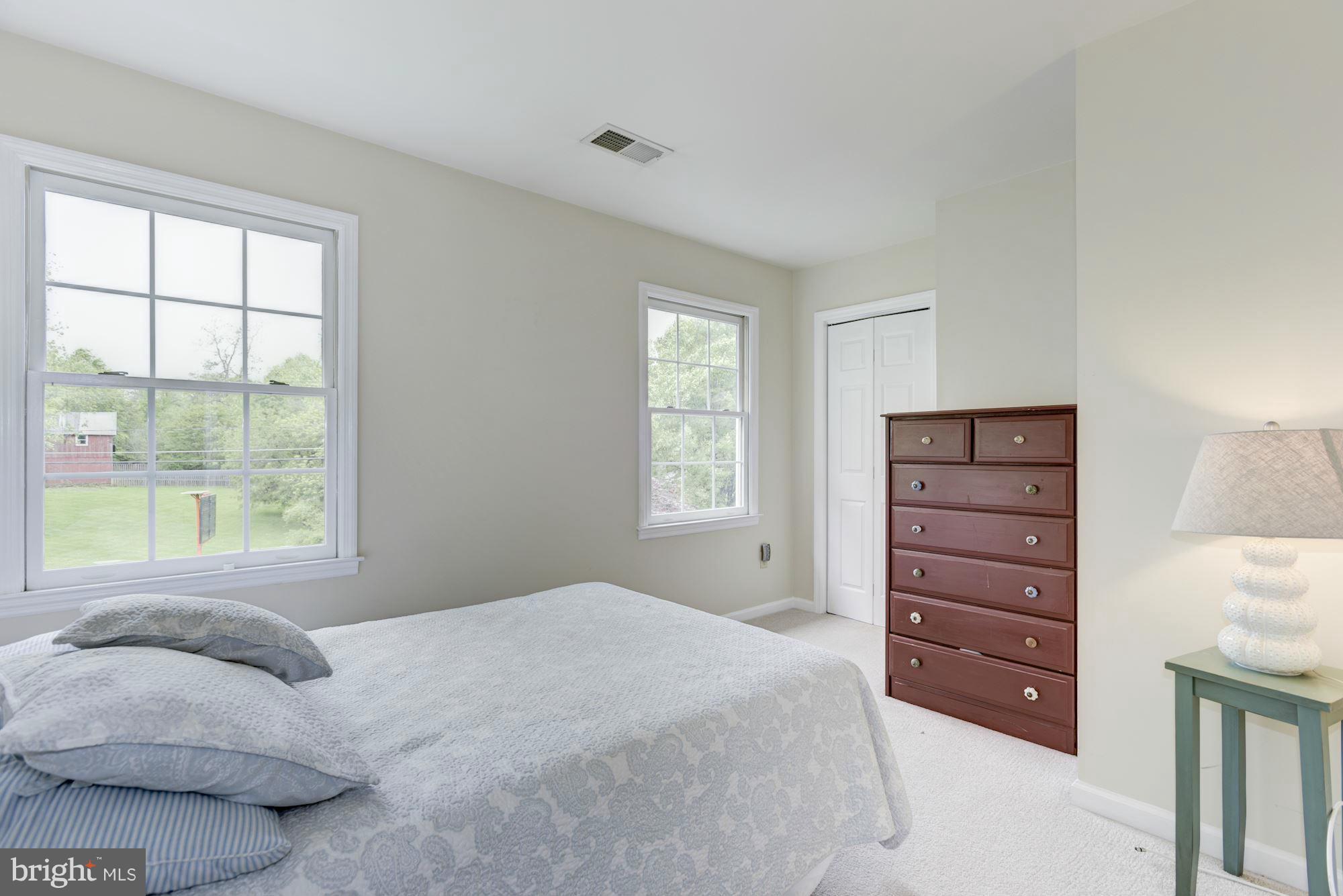 17 New Cut Road Round Hill, VA 20141 - Photo 18 of 29 a bedroom with a bed and a dresser